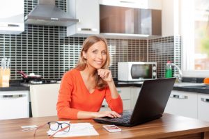 Woman Working With Laptop at Home